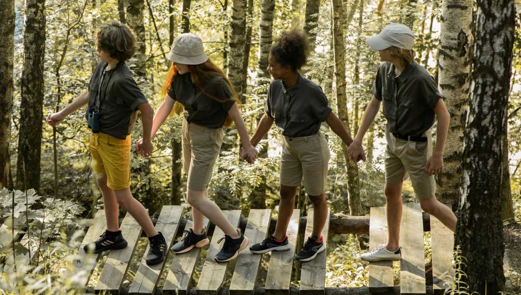 Youth working together during camping for children programs