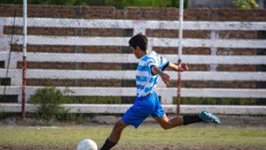 Skilled boy playing football in a field -Camp Adventures - Sheikh Sultan Award for Celebrating the Spirit of Youth
